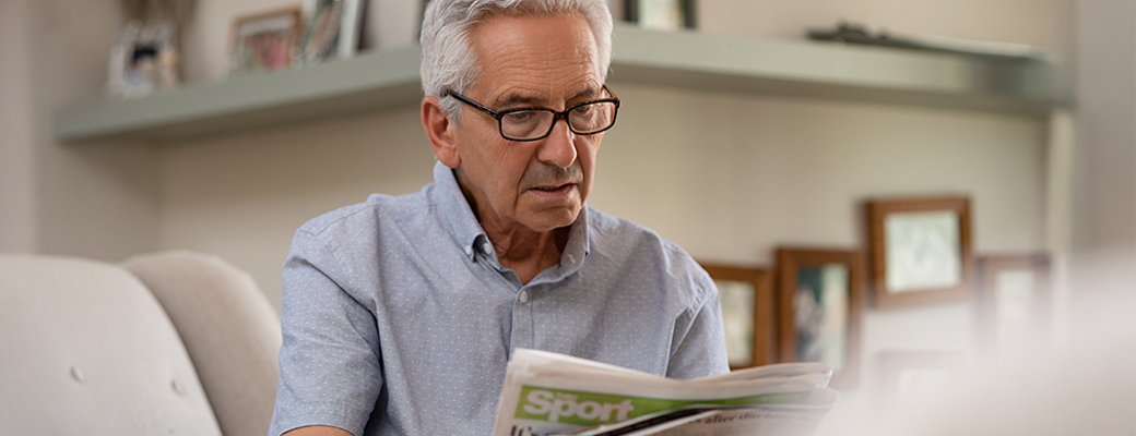 Image of senior man reading a book